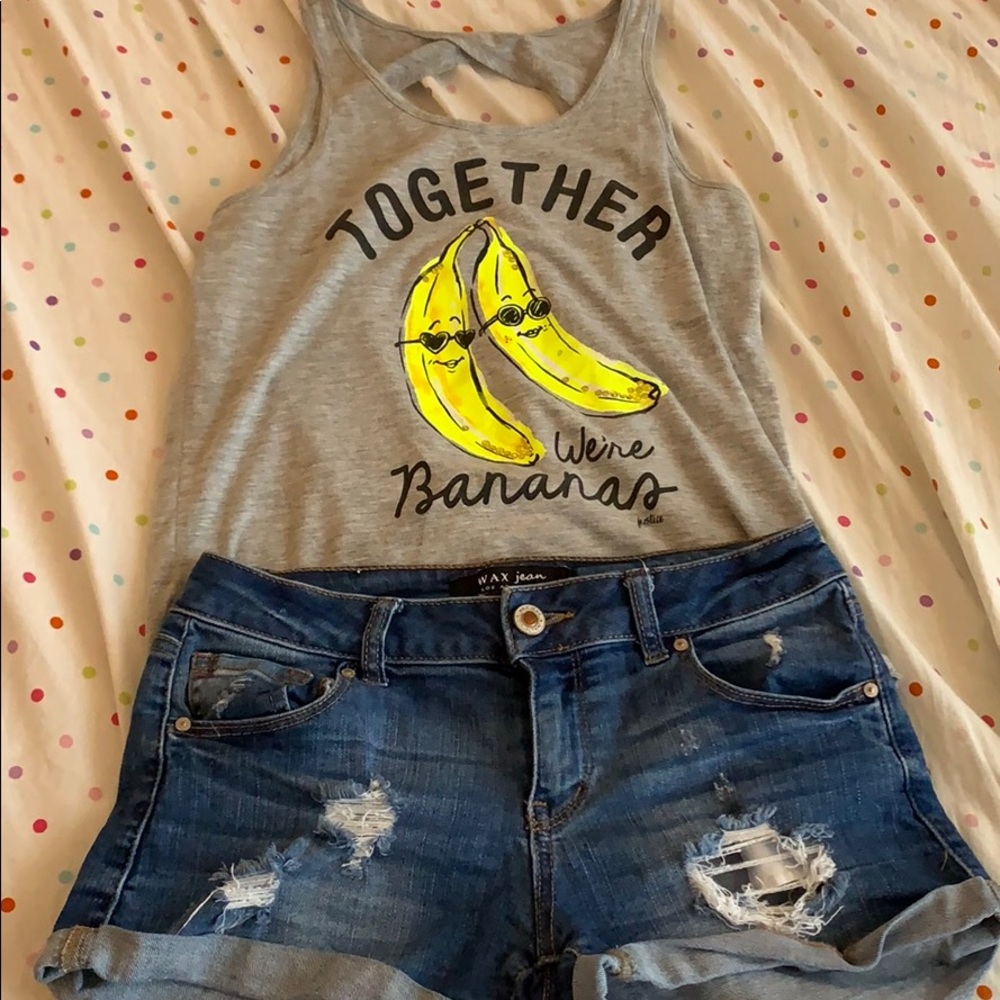 Tank top with ripped jean shorts